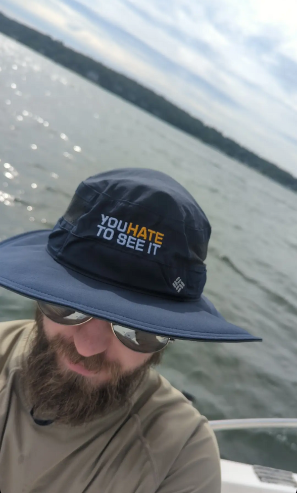Columbia bucket hat with the phrase "YOU HATE TO SEE IT" on the front